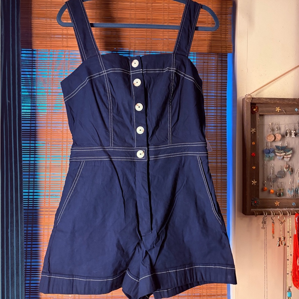 Maeve Navy Blue Nautical Jumpsuit with White Buttons and adjustable straps.